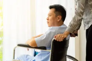 man in wheelchair in hospital room