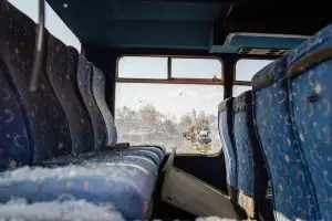 smashed glass on bus seats