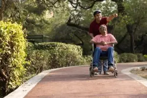 man-pushing-other-man-in-wheelchair