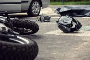 motorcycle and silver car accident