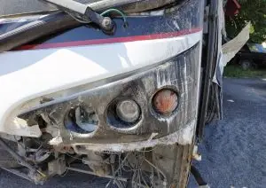 smashed front bumper of a bus