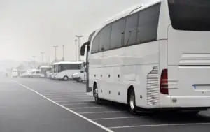 white tour bus parked