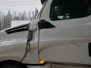 smashed-in white truck