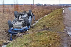 blue-car-rolled-over-into-a-ditch