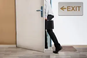businessman walking out of an office