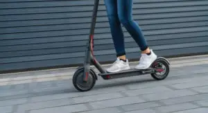 girl riding electric scooter