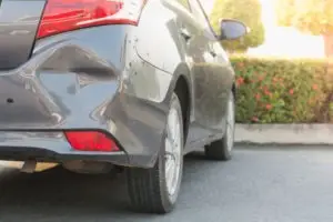 gray car with hit-and-run damage