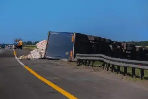 overturned tractor-trailer in guardrail