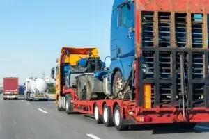 flatbed-truck-driving-down-the-road