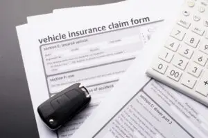 insurance claim form with car keys