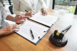 lawyer and client reviewing settlement agreement