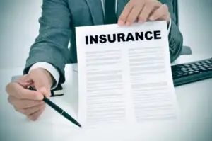 man offering insurance policy to sign