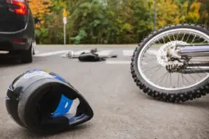 A motorcycle helmet on the ground after an accident.