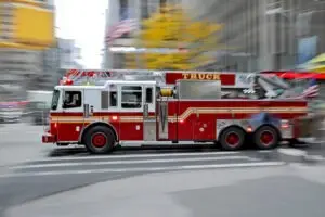 A fire truck speeds through an intersection. What happens if a fire truck hits you?