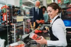 This grocery store worker’s wrists could get damaged from scanning groceries. Speak with John Foy & Associates if you need to make a workers’ comp claim against Publix.