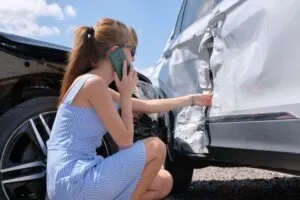 Woman at accident scene asks insurer what happens if car is totaled but still drivable.