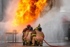 Firemen battle a blaze while wondering what caused the BioLab fire.