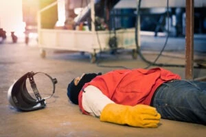 An injured subcontractor lying on the ground