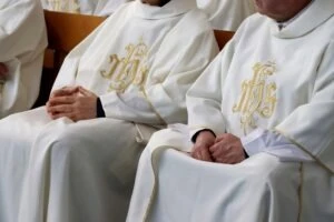 Two members of the church sit and listen to information about the Georgia statute of limitations for clergy abuse cases.