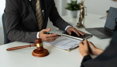 Lawyer meets with client to explain who can be a whistleblower.