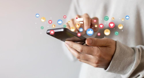 Teen hand hold smartphone and use social media network application to check new feedback or interactive with people or friend by reply chat or send emoticon for react feeling and moment concept.