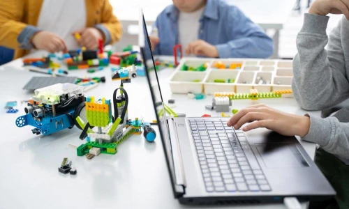 Robotics programming class. Children construct and code Robot
