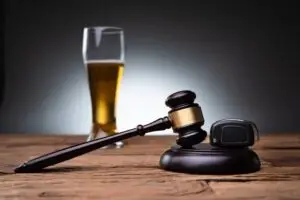 gavel next to a beer