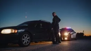 police officer pulling over a driver