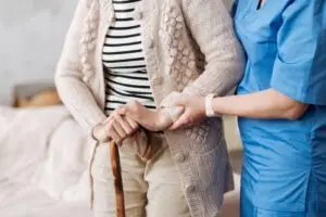 nurse helping an older resident
