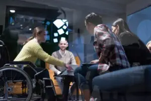 woman in a wheelchair at a meeting