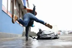 person falling on slippery sidewalk