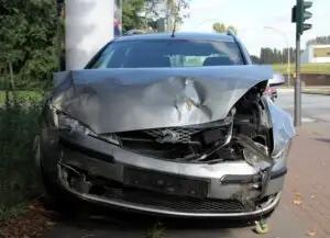 silver car after head-on collision