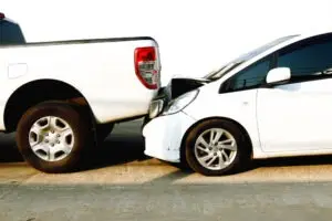 white car and truck in accident