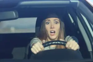woman about to get into a left-turn accident