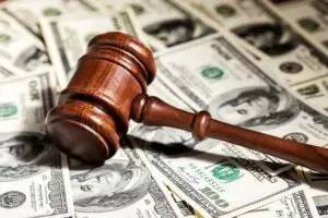 gavel on a pile of money