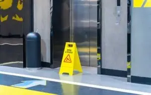 slippery floor sign at elevator