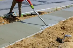worker laying new concrete