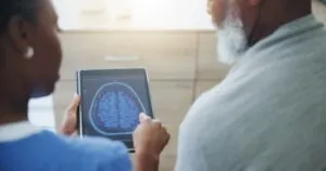 doctor reviewing brain scan with a patient