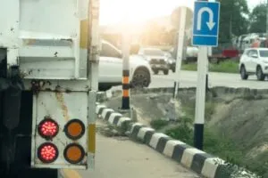 cars making wide turn around a corner