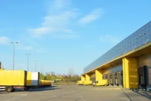 DHL trucks in a parking lot