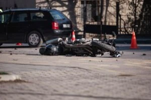 A crashed motorcycle. What is the primary cause of motorcycle crashes?