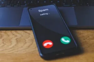 A phone gets a spam call from a law firm. Why is our law firm’s number labeled as spam or scam likely?