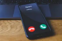 A phone gets a spam call from a law firm. Why is our law firm’s number labeled as spam or scam likely?