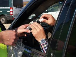 A man blowing into a breathalyzer