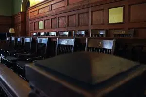 An empty jury box in a courtroom