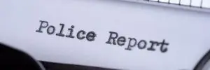 typewriter showing police report