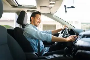 male driver adjusting controls