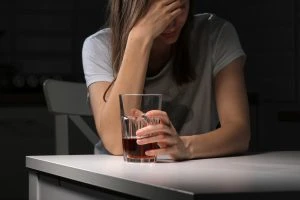 young woman with an alcoholic beverage