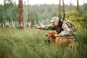 A man hunting. Find out if you can get a hunting license with a DUI.