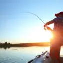 A person fishing. Learn about getting a fishing license with a DUI in California. 